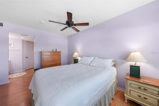 bedroom with ceiling fan and light hardwood / wood-style floors