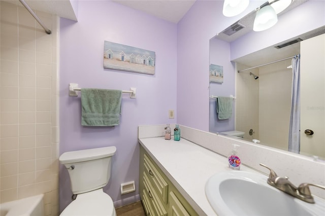 full bath with visible vents, vanity, shower / bath combo with shower curtain, and toilet