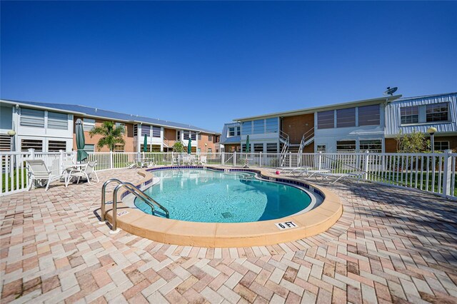 view of swimming pool featuring a patio