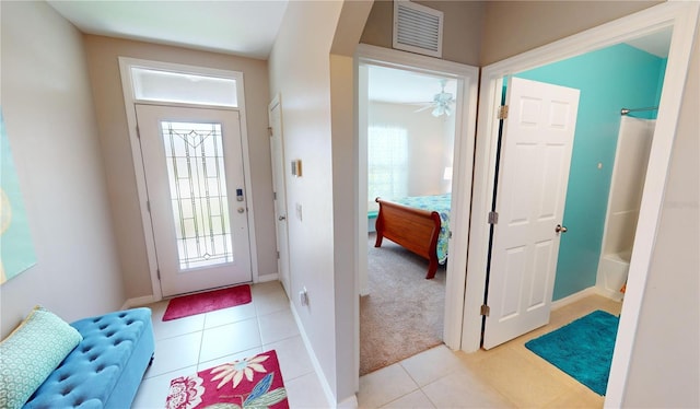 entrance foyer featuring ceiling fan and light tile patterned flooring