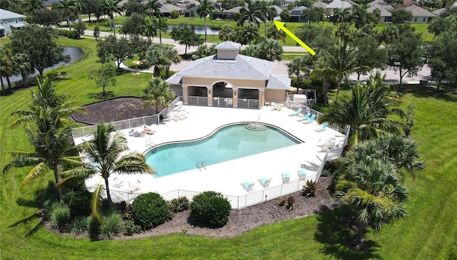 view of pool with a water view and a patio