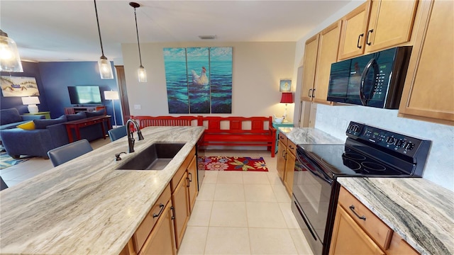 kitchen featuring light stone countertops, sink, black appliances, pendant lighting, and light tile patterned flooring