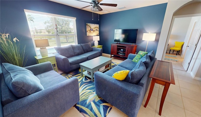 living room with ceiling fan and light tile patterned flooring