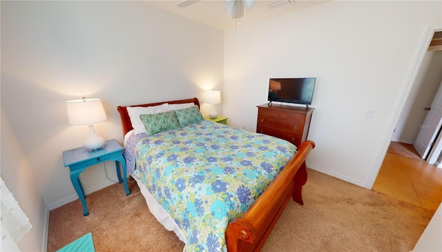 bedroom with light colored carpet