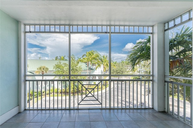 unfurnished sunroom featuring plenty of natural light