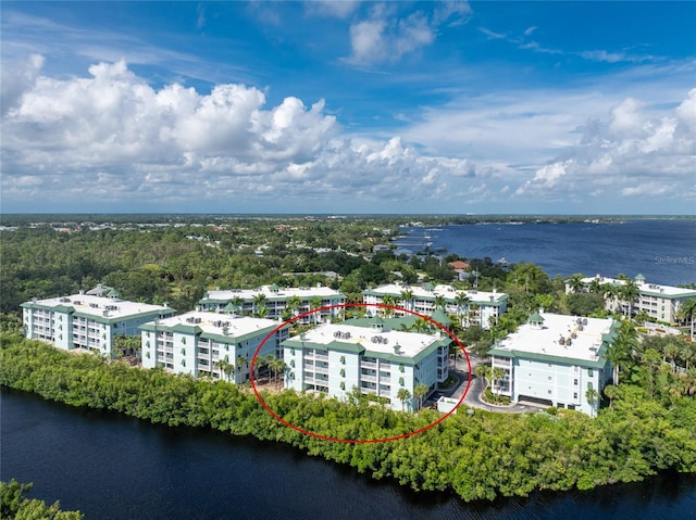 birds eye view of property with a water view