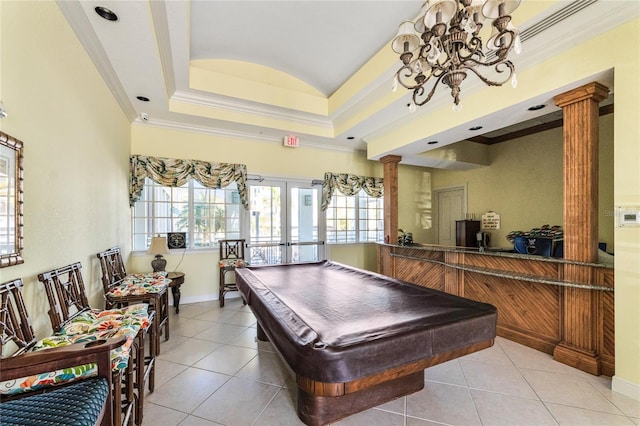 recreation room featuring billiards, a tray ceiling, ornate columns, and light tile patterned floors