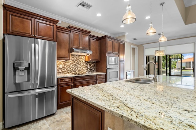 kitchen with visible vents, ornamental molding, stainless steel appliances, under cabinet range hood, and a sink