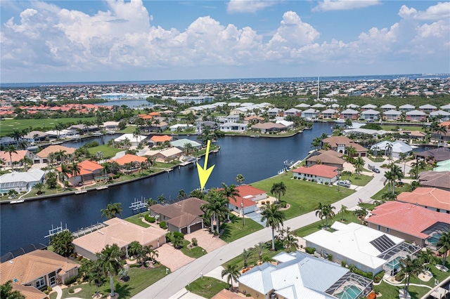 aerial view with a water view and a residential view