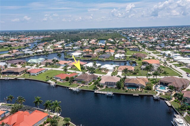 bird's eye view with a residential view and a water view