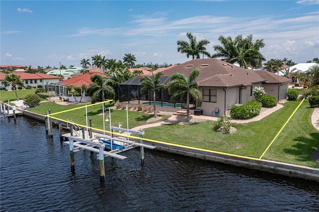 dock area featuring an outdoor pool, boat lift, a lanai, a water view, and a yard