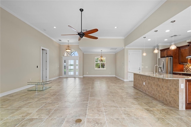 interior space with ceiling fan, baseboards, stainless steel refrigerator with ice dispenser, backsplash, and light stone countertops