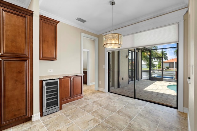 kitchen with decorative light fixtures, wine cooler, light tile patterned flooring, ornamental molding, and light stone counters