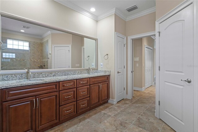 bathroom with ornamental molding, tile patterned floors, and dual bowl vanity