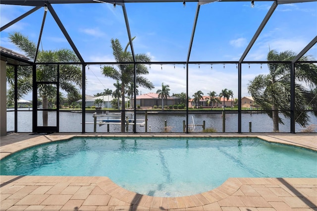 view of swimming pool with a lanai