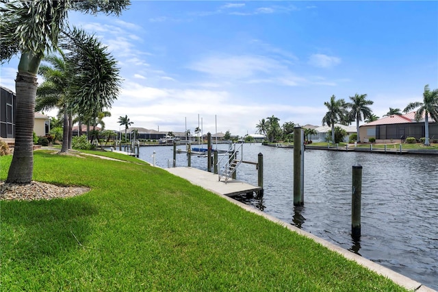 view of dock featuring a yard and a water view