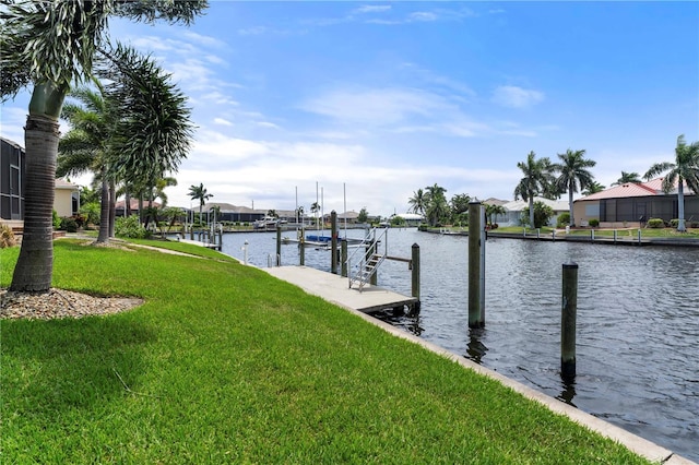 dock area featuring a lawn, a water view, and boat lift