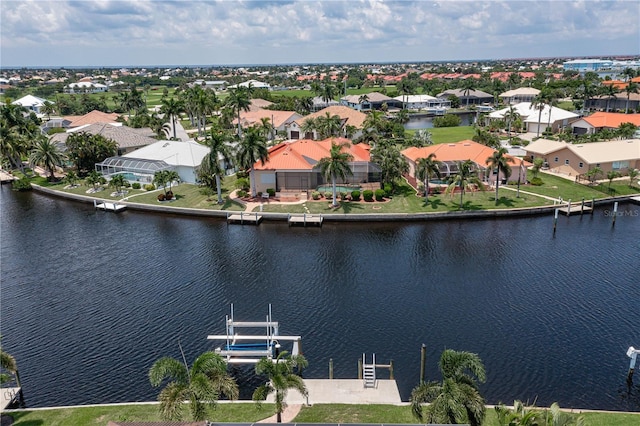 birds eye view of property featuring a water view and a residential view