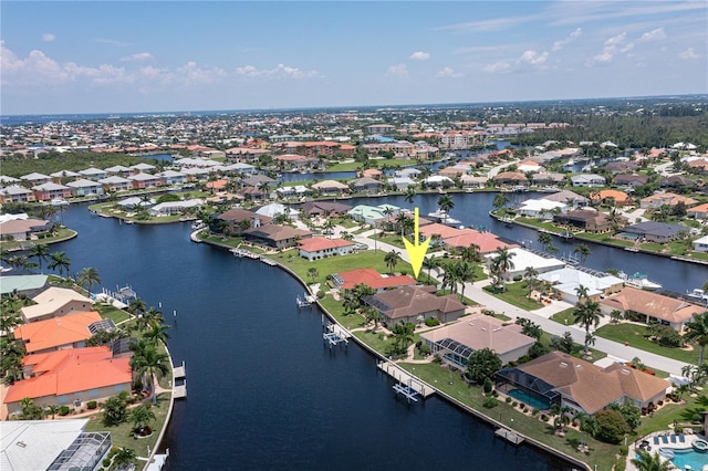 bird's eye view with a water view and a residential view