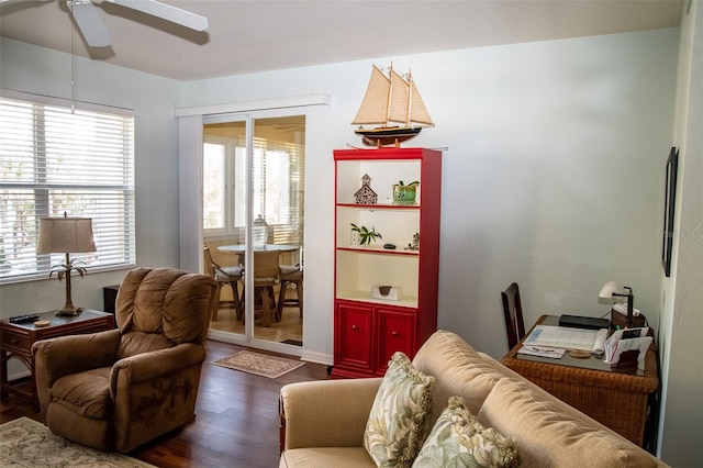 living room with ceiling fan and hardwood / wood-style flooring