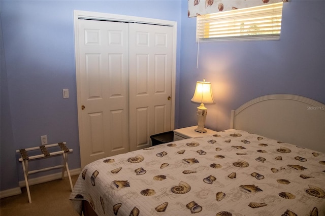 carpeted bedroom featuring a closet