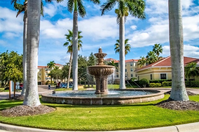 view of home's community featuring a lawn