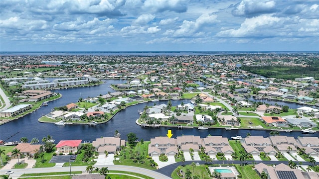 bird's eye view featuring a water view and a residential view