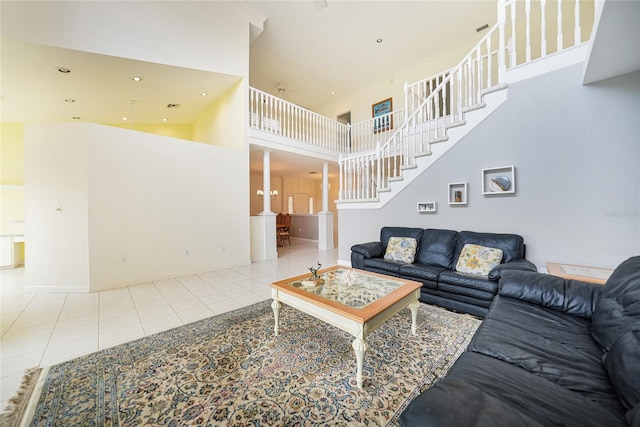 living room featuring a high ceiling and light tile patterned floors