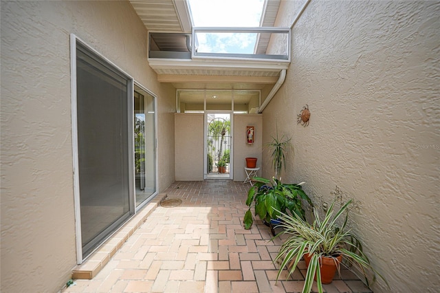 doorway to property with stucco siding