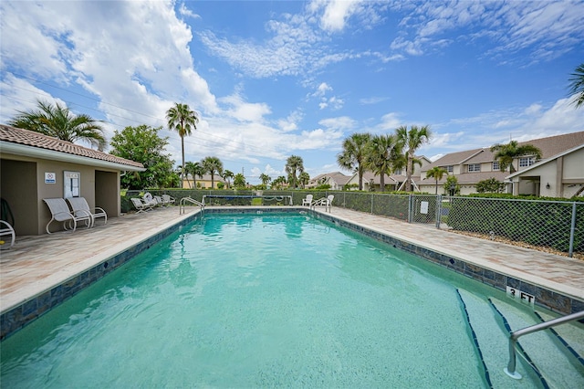 view of swimming pool featuring a patio area