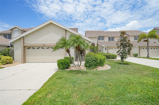 view of front of home with a garage and a front yard