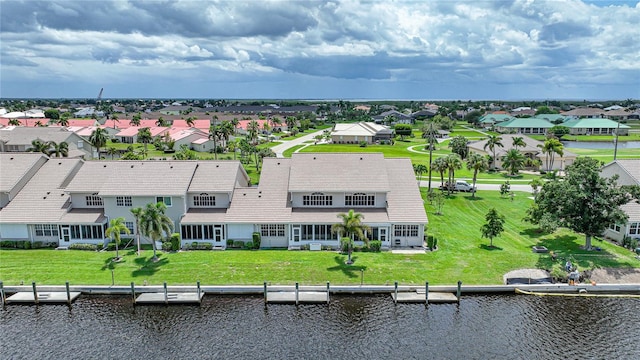 bird's eye view with a water view and a residential view