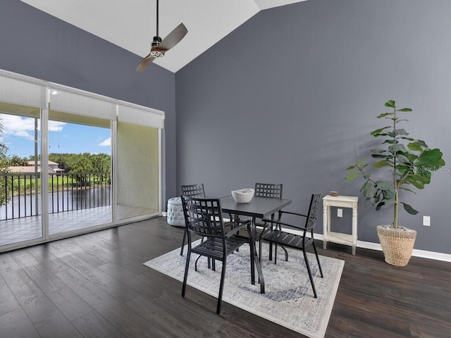 dining room with ceiling fan, high vaulted ceiling, and dark hardwood / wood-style floors