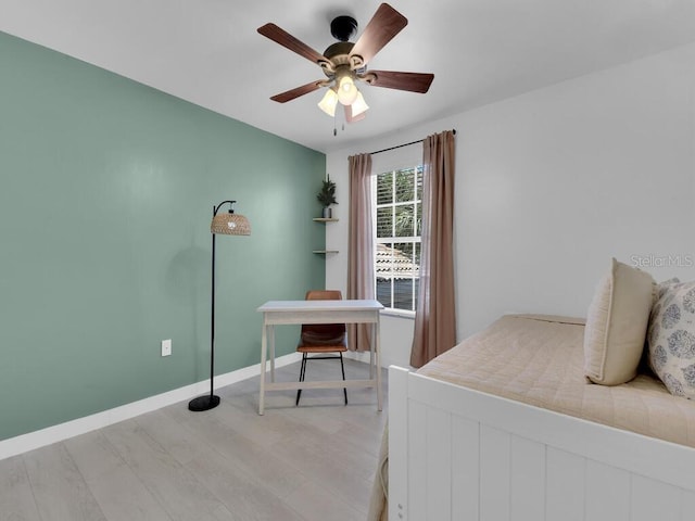 bedroom with light wood-type flooring and ceiling fan