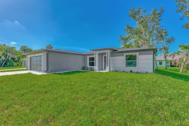 single story home with a front yard and a garage