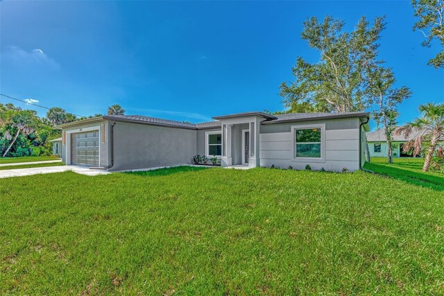 4582 Enid Ln, North Port, FL 34288 - ranch-style home with a garage, a front yard, concrete driveway, and stucco siding