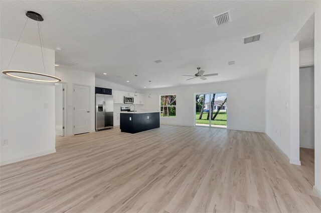 4582 Enid Ln, North Port, FL 34288 - unfurnished living room featuring light wood finished floors, ceiling fan, recessed lighting, and baseboards