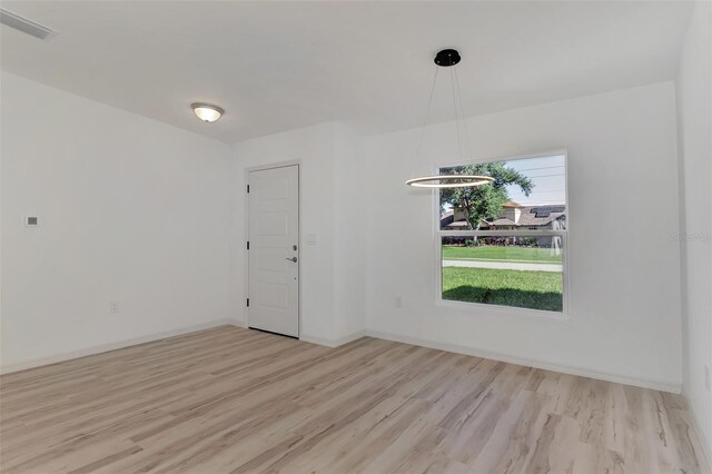 4582 Enid Ln, North Port, FL 34288 - unfurnished room with wood finished floors and baseboards