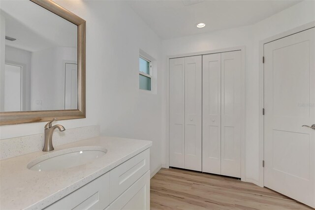 4582 Enid Ln, North Port, FL 34288 - bathroom with wood finished floors, vanity, a closet, and recessed lighting