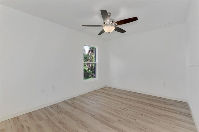 4582 Enid Ln, North Port, FL 34288 - unfurnished room featuring wood finished floors, a ceiling fan, and baseboards