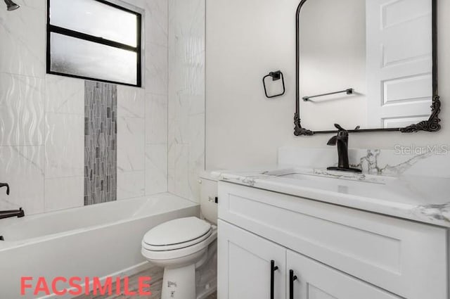 full bathroom featuring tiled shower / bath combo, vanity, and toilet