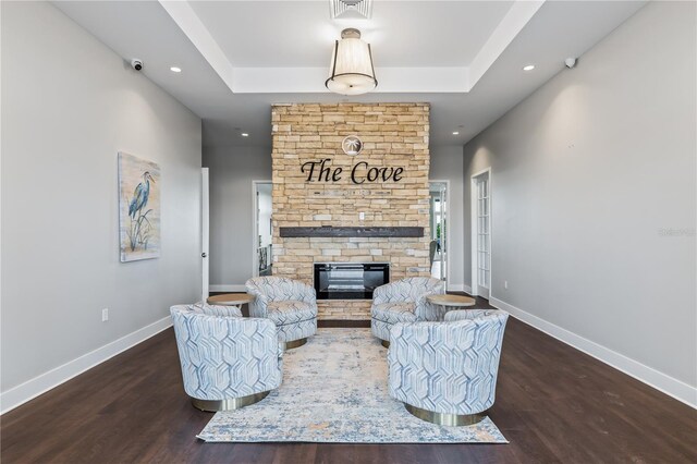 16423 Bridle Ridge St, Port Charlotte, FL 33953 - living room with a fireplace, wood finished floors, baseboards, recessed lighting, and a raised ceiling