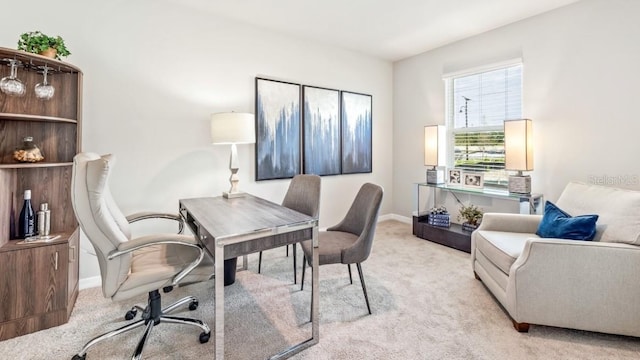 home office with light colored carpet and baseboards