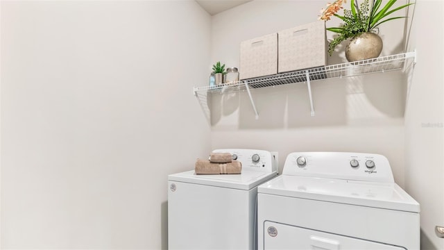 clothes washing area featuring laundry area and washer and dryer