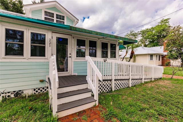 exterior space featuring a wooden deck and a yard