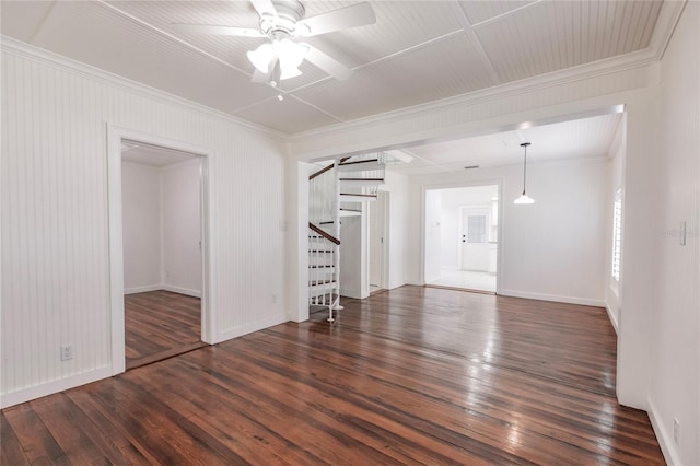 spare room with dark hardwood / wood-style flooring and ceiling fan