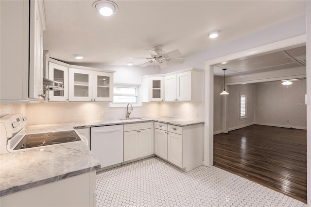 kitchen with backsplash, white appliances, ceiling fan, light tile patterned floors, and white cabinets