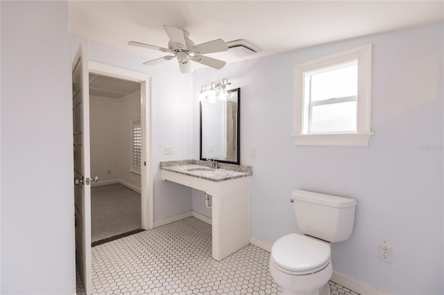 bathroom featuring ceiling fan, sink, tile patterned floors, and toilet