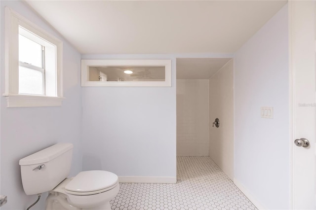 bathroom featuring tile patterned flooring and toilet