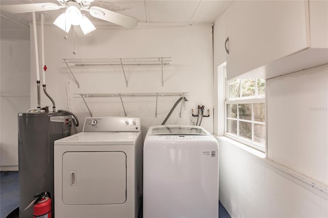 clothes washing area with ceiling fan, water heater, and independent washer and dryer